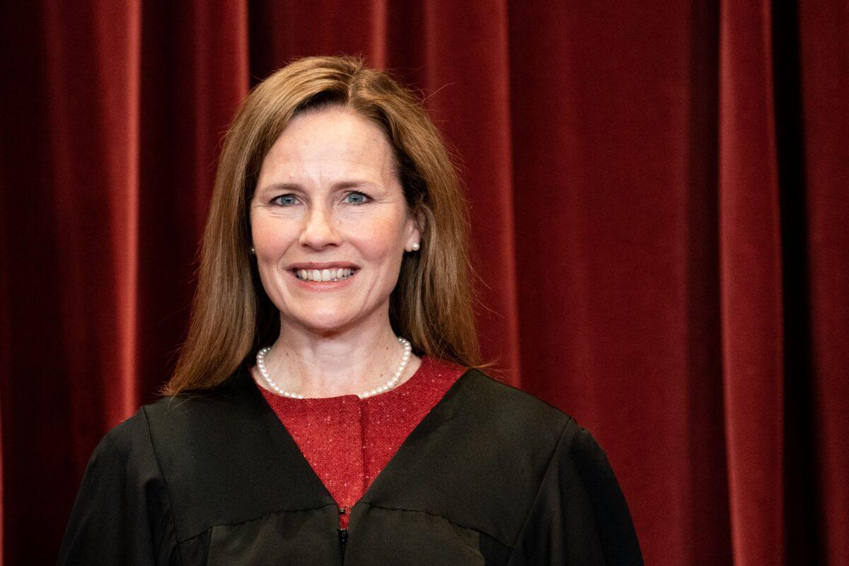 Associate Justice Amy Coney Barrett stands during a group photo of the Justices at the Supreme Court in Washington on April 23, 2021. (Erin Schaff/AFP via Getty Images)