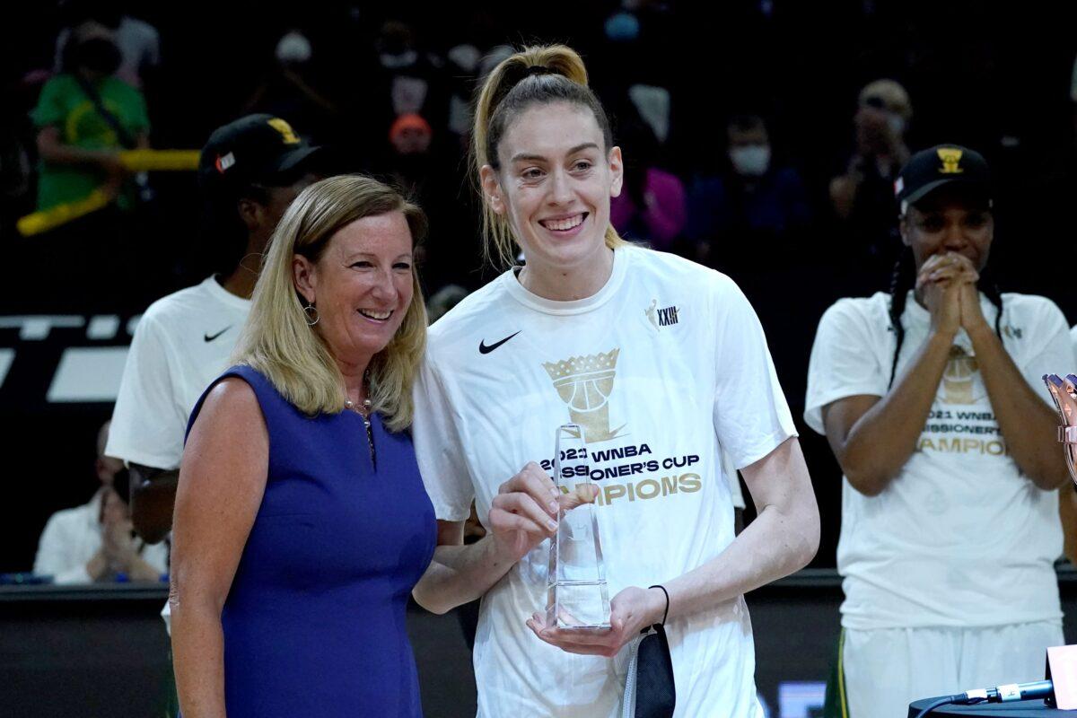 Seattle Storm forward Breanna Stewart holds the MVP trophy after the Commissioner's Cup WNBA basketball game against the Connecticut Su, in Phoenix, on Aug. 12, 2021. (Matt York/AP Photo)
