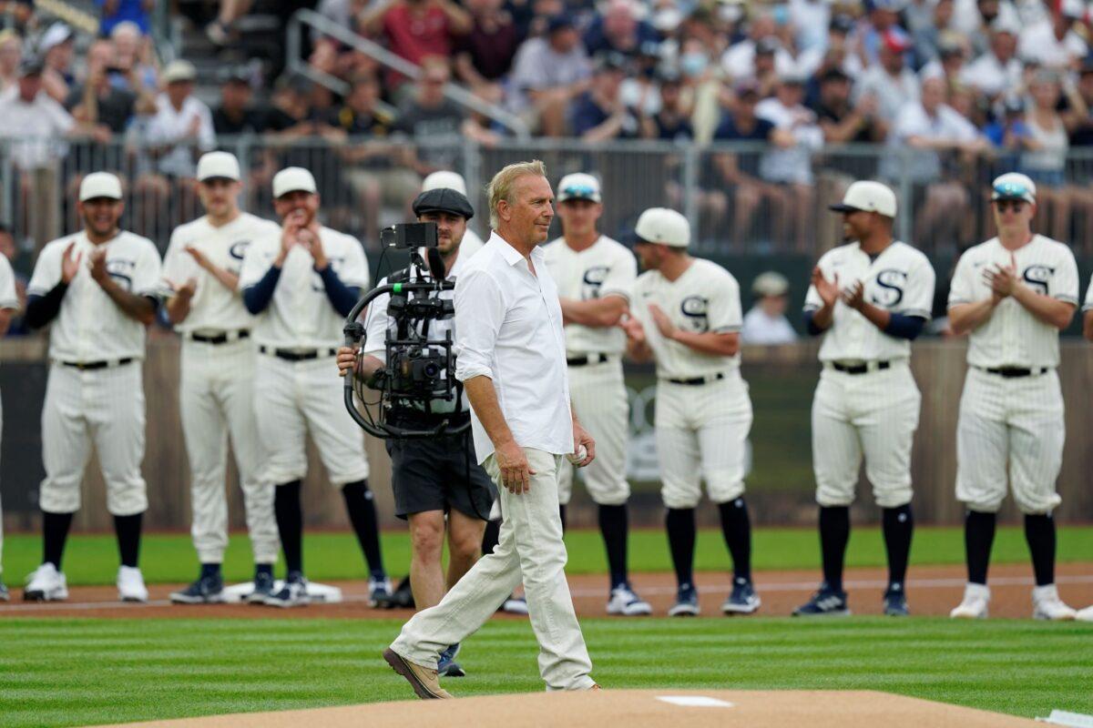 Actor Kevin Costner walks to the stands before a baseball game between the New York Yankees and Chicago White Sox, in Dyersville, Iowa, on Aug. 12, 2021. (Charlie Neibergall/AP Photo)