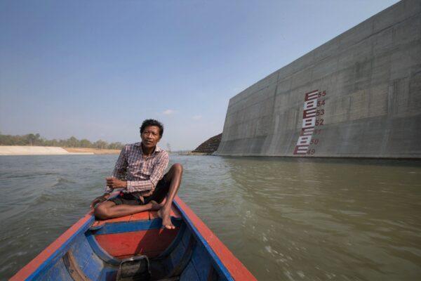 A villager stands where his home used to be before it was bulldozed to make way for the Sesan Two Dam in Stung Treng, Cambodia, on May 7, 2015. (Jason South/Fairfax Media/Getty Images)