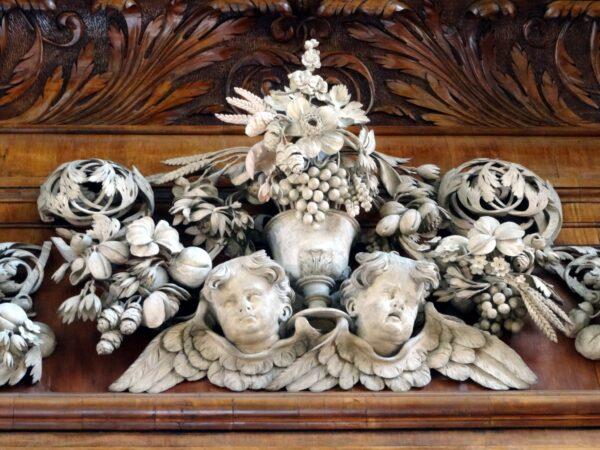 Limewood cherubs surmounting the reredos by Grinling Gibbons at Trinity College Chapel, Oxford. (Bob Easton)