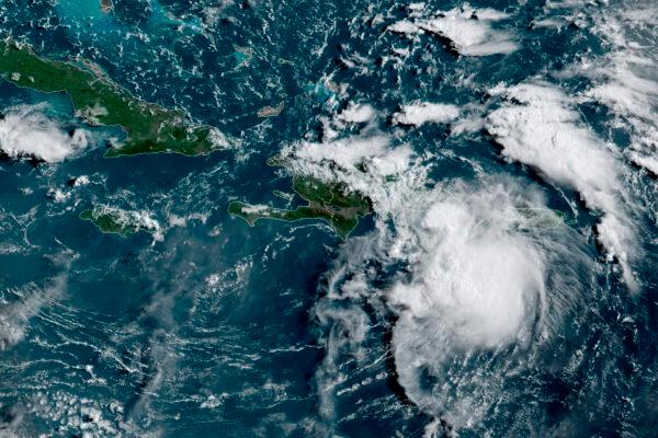This satellite image shows a Tropical Storm Fred in the Caribbean as it passes south of Puerto Rico and the Dominican Republic at 8am ET, on Aug. 11, 2021. (NOAA/NESDIS/STAR GOES via AP)