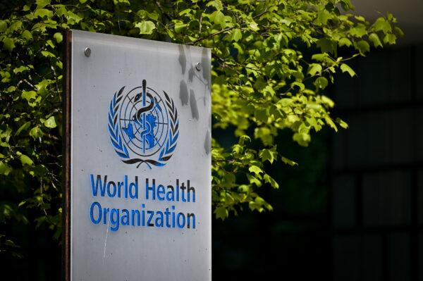 A sign of the World Health Organization (WHO) at the entrance of their headquarters in Geneva, on May 8, 2021. (Fabrice Coffrini/AFP via Getty Images)