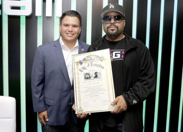 Compton City Council member Isaac Galvan's reelection was overturned by a judge and he faces criminal charges for election fraud. Here Galvan (L) presents Ice Cube with a "Celebration of Life" award from the City of Compton, on June 14, 2018. (Rachel Murray/Getty Images for Dream Hollywood )