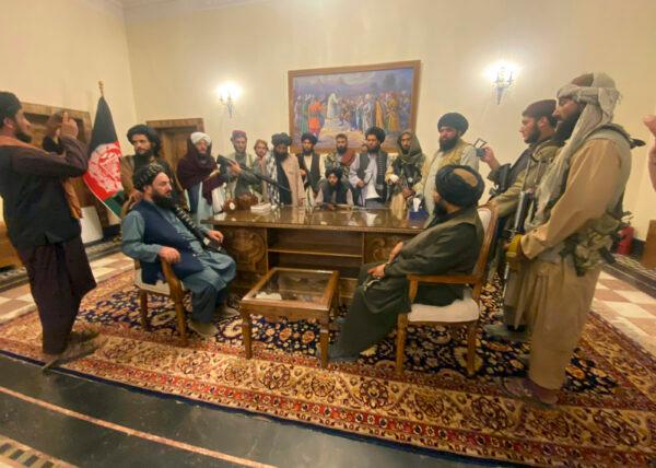 Taliban insurgents congregate in the Afghan presidential palace after Afghan President Ashraf Ghani fled the country in Kabul, Afghanistan, on Aug. 15, 2021. (Zabi Karimi/AP Photo)