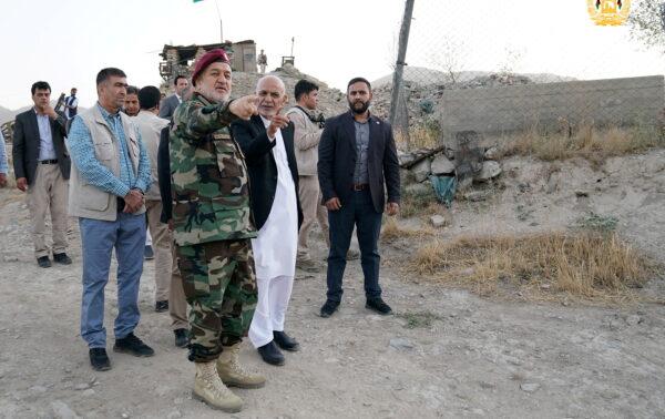 Afghanistan's President Ashraf Ghani and acting defence minister Bismillah Khan Mohammadi visit military corps in Kabul, Afghanistan, on Aug. 14, 2021. (Afghan Presidential Palace/Handout via Reuters)