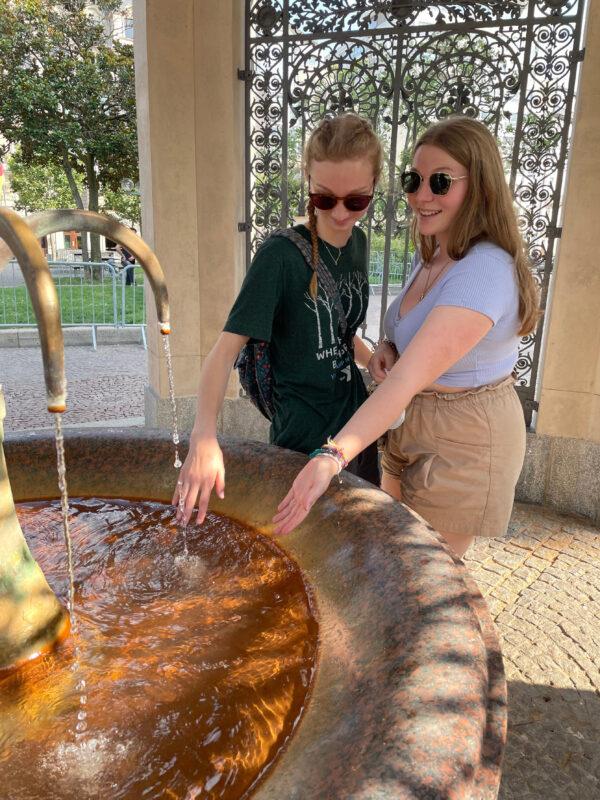 Two young travelers try the famous waters from the hot springs in Wiesbaden, Germany. (Lesley Sauls Frederikson)