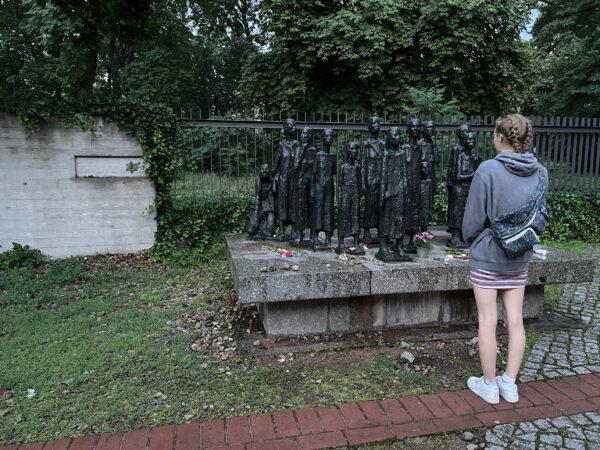 A student pauses at a memorial to deported Jews in Berlin. (Lesley Sauls Frederikson)
