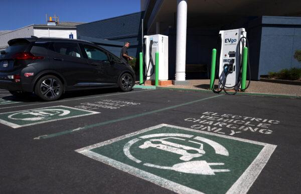 An electric car owner prepares to charge his car at a station in Corte Madera, Calif., on Sept. 23, 2020. (Justin Sullivan/Getty Images)