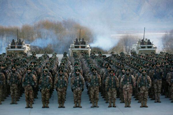 This photo taken on January 4, 2021 shows Chinese People's Liberation Army (PLA) soldiers assembling during military training at Pamir Mountains in Kashgar, northwestern China's Xinjiang region. (STR/AFP via Getty Images)