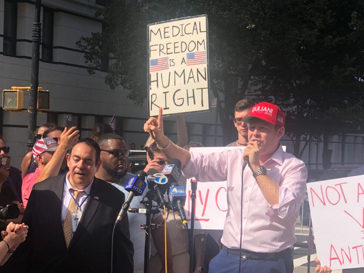 Andrew Giuliani speaks at a rally against vaccine mandates outside Gracie Mansion in NYC, on Aug. 15, 2021. (Enrico Trigoso/The Epoch Times)