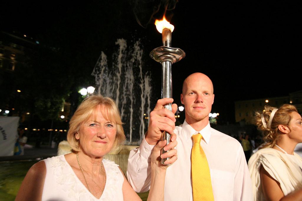 1964 Summer Olympics silver-medalist Jan Becker (L) and 2006 Winter Olympics bronze-medalist Martins Rubenis at the official opening of the Global Human Rights Torch Relay in Athens, Greece, on the evening of August 9, 2007. (<a href="https://www.flickr.com/people/14871980@N05">longtrekhome</a>/Flickr)