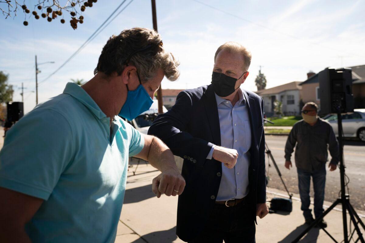 Former San Diego Mayor Kevin Faulconer (C) greets a supporter after a news conference in the San Pedro section of Los Angeles on Feb. 2, 2021. (Jae C. Hong/AP Photo)