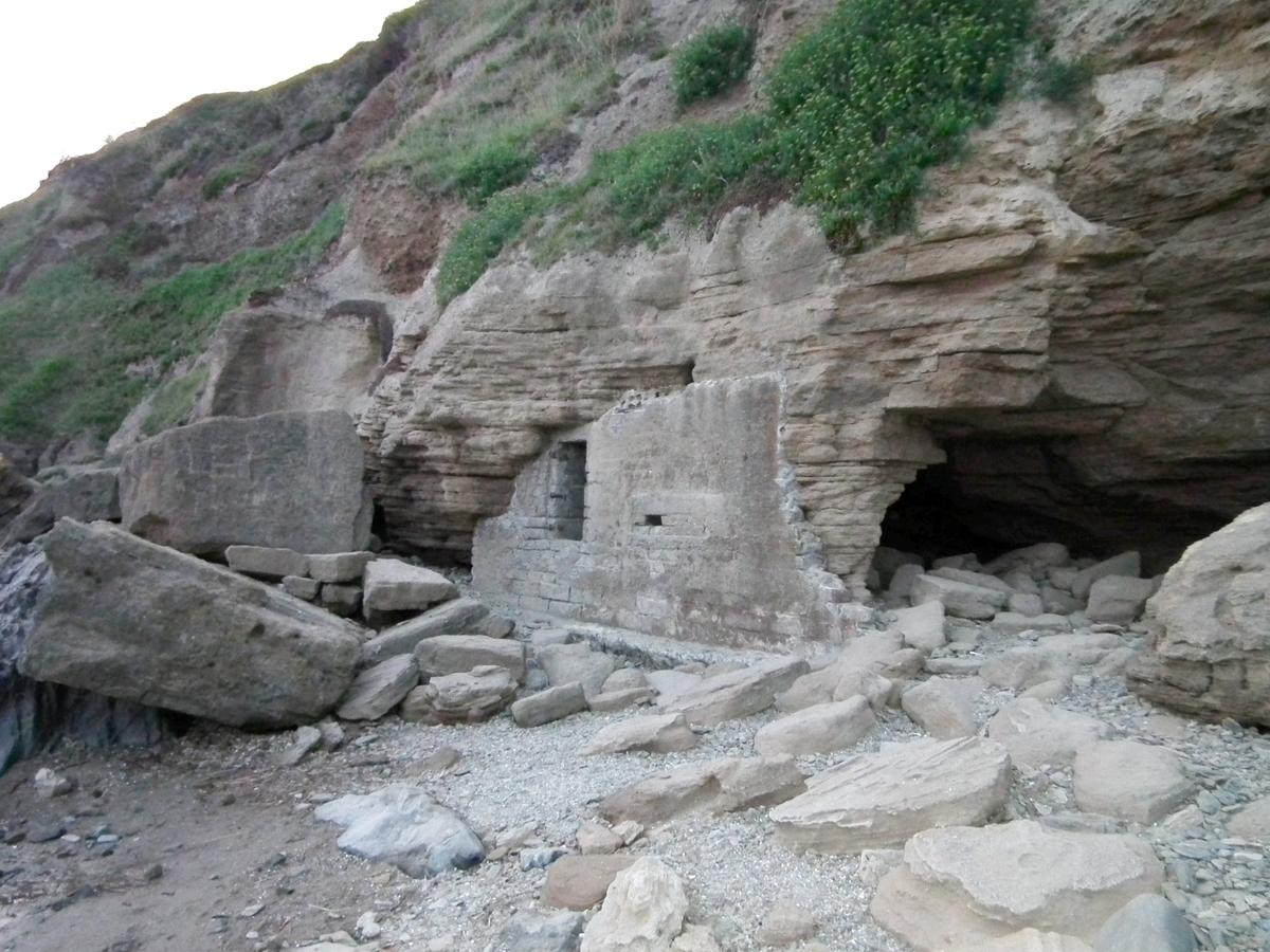 The archaeologist discovered a previously unrecorded WWII bunker—while eating fish and chips on the beach. (SWNS)