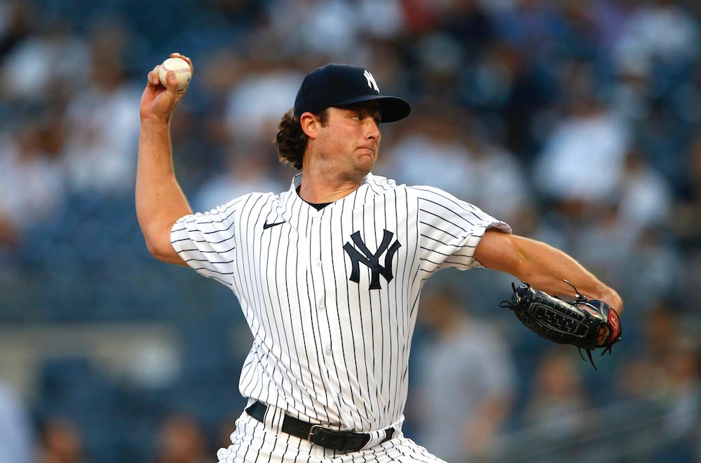 New York Yankees starting pitcher Gerrit Cole (45) throws against the Los Angeles Angels during the first inning of a baseball game in New York on Aug. 16, 2021. (AP Photo/Noah K. Murray)