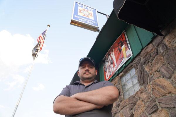 Gabriel Winse of Flagstaff, Arizona, stands outside VFW Post 1709 in Flagstaff on Aug.16, 2021, a day after the fall of Afghanistan to the Taliban. Winse, a Marine Corps veteran who served two tours in Iraq, said his sincere hope is that U.S. soldiers in Afghanistan "didn't die for nothing." (Allan Stein/The Epoch Times)