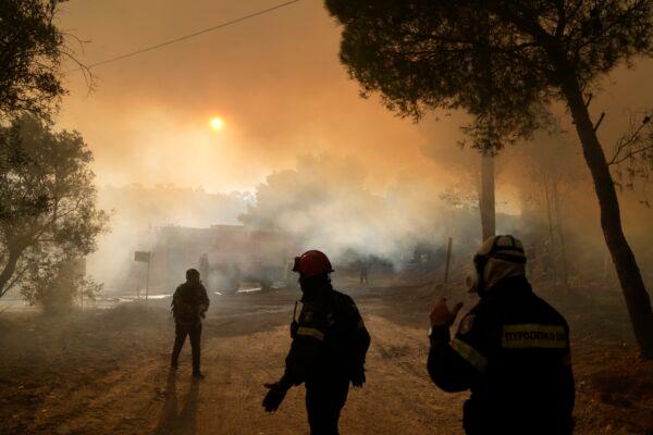 Firefighters operate during a wildfire in Siderina village about 55 kilometers (34 miles) south of Athens, Greece, on Aug. 16, 2021. (Thanassis Stavrakis/AP Photo)