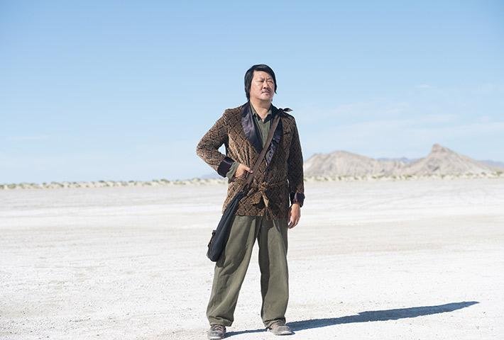 Kyo (Benedict Wong) stands in the desert, in “Nine Days.” (Michael Coles/Sony Pictures Classics)