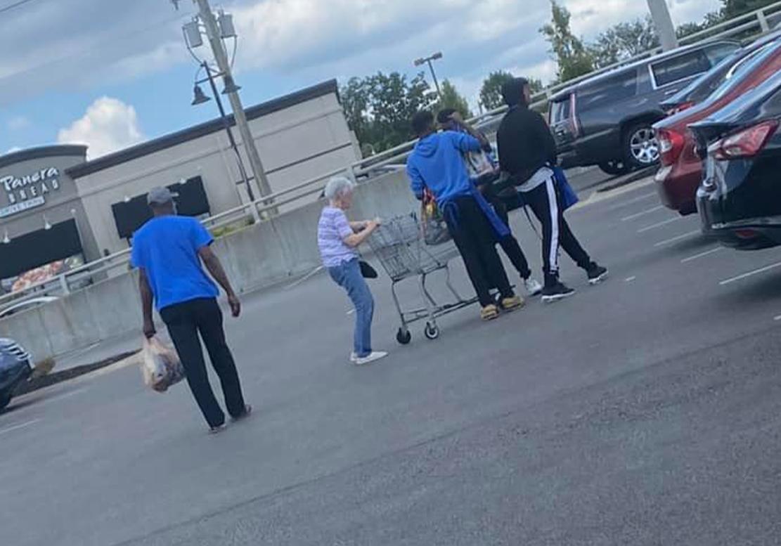 Victoria Curtis, 36, snapped this photo of three young men helping the elderly woman struggling with groceries to her car. (Courtesy of <a href="https://www.facebook.com/mrscollinsbaby">Victoria Curtis</a>)
