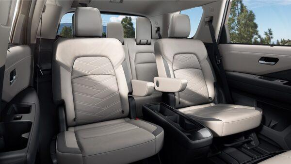 Available second-row captain's chairs and storage inside doors. (Courtesy of Nissan)