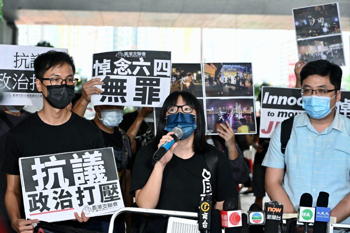 Hang-Tung Chow (center), vice chairperson of the Hong Kong Alliance in Support of Patriotic Democratic Movements of China, speaks outside court over last year's "June 4" rally in Hong Kong, on June 11, 2021. (Bilong Song/The Epoch Times)