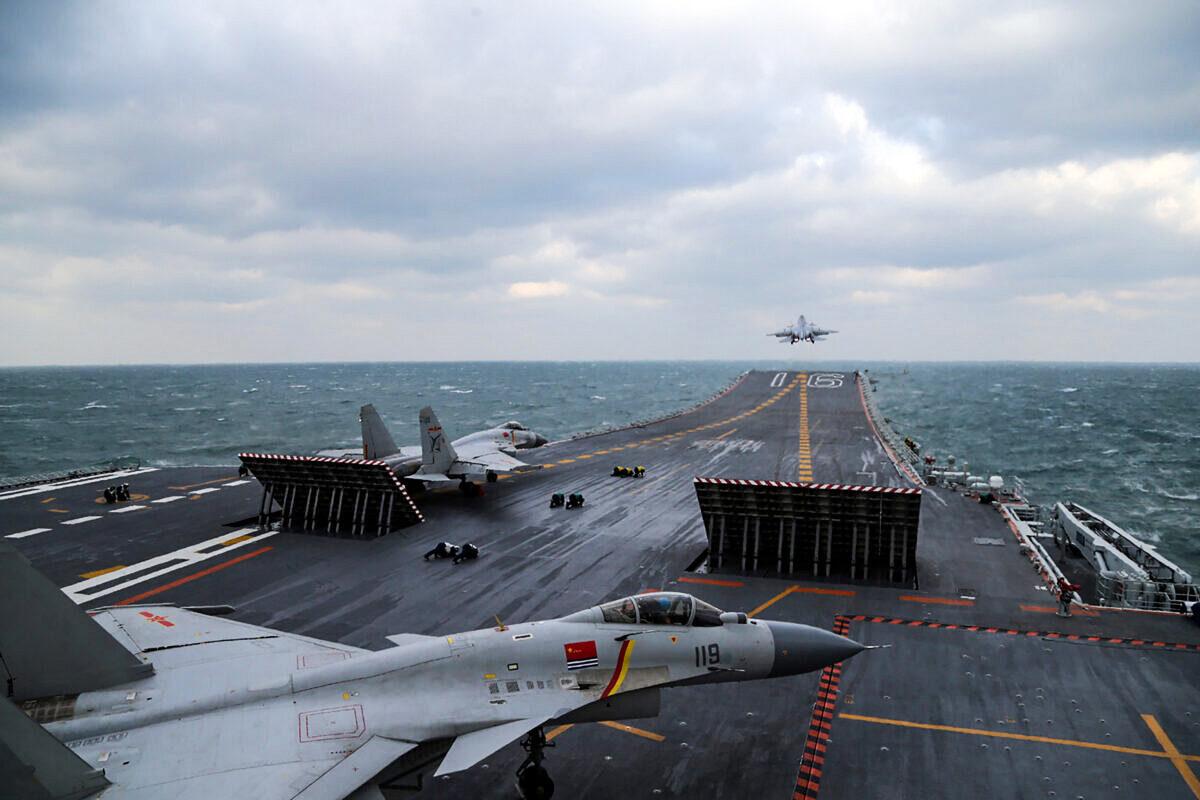 Chinese J-15 fighter jets are launching from the deck of the Liaoning aircraft carrier during military drills in the Yellow Sea, off China's east coast on Dec. 23, 2016.  (STR/AFP via Getty Images)