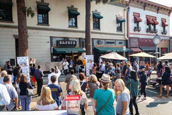 People in the city of Orange gathered in celebrating the Orange Chamber of Commerce 100 Year Anniversary in Orange, Calif., on Aug. 17, 2021. (John Fredricks/The Epoch Times)