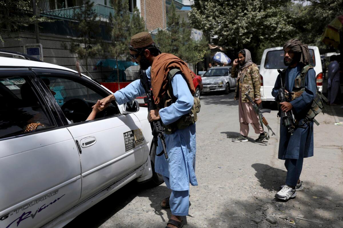 Taliban terrorists man a checkpoint in Kabul, Afghanistan, on Aug. 18, 2021. (Rahmat Gul/AP Photo)