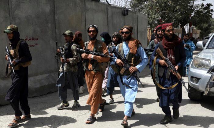 Taliban Violently Break Up Protest in Afghanistan as Thousands Try to Flee Kabul