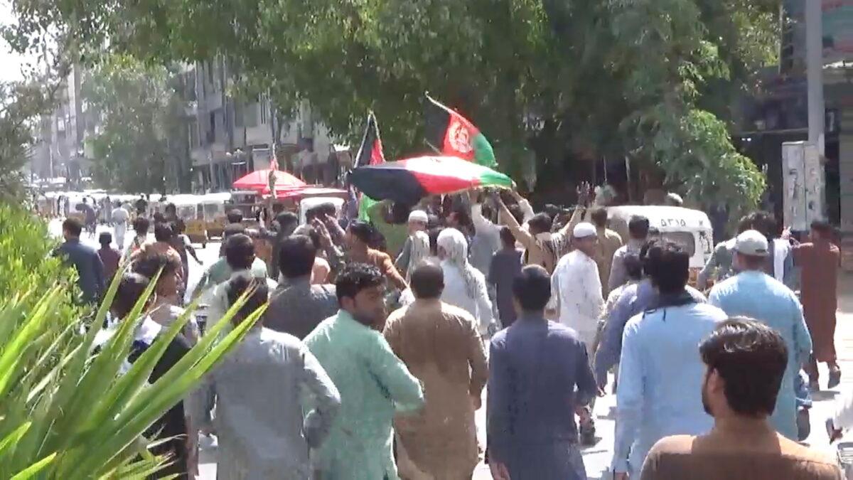 People carry Afghan flags as they take part in an anti-Taliban protest in Jalalabad, Afghanistan, on Aug. 18, 2021. (Pajhwok Afghan News/Handout via Reuters)