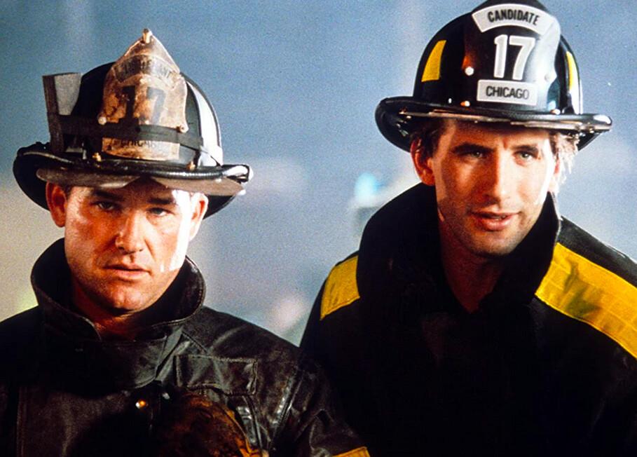 Stephen (Kurt Russell, L) and Brian (William Baldwin) are firefigher brothers, in “Backdraft.” (Universal Pictures)