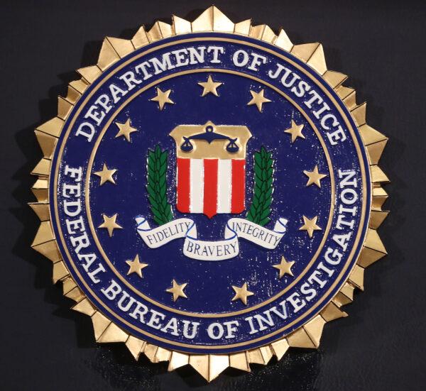  The FBI seal is attached to a podium at a news conference at FBI headquarters in Washington on June 14, 2018. (Mark Wilson/Getty Images)