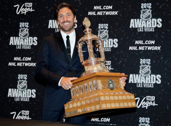 New York Rangers' Henrik Lunqvist poses with the Vezina Trophy after winning the award for the league's best goalie during the NHL Awards in Las Vegas, on June 20, 2012. (Julie Jacobson, File/AP Photo)