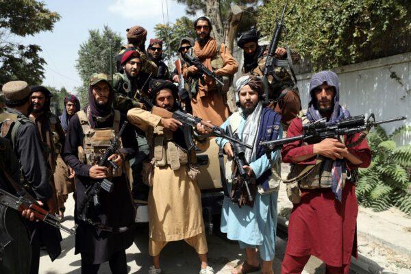 Taliban extremists pose for a photograph in Kabul, Afghanistan, on Aug. 19, 2021. (Rahmat Gul/AP Photo)