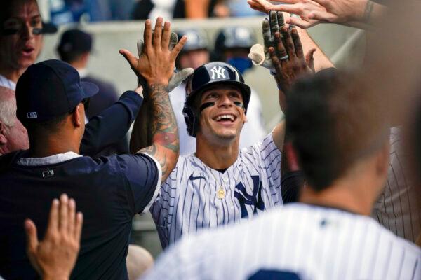 New York Yankees' Andrew Velazquez celebrates after hitting a solo home run in the eighth inning of a baseball game against the Minnesota Twins in New York, on Aug. 21, 2021. (Mary Altaffer/AP Photo)