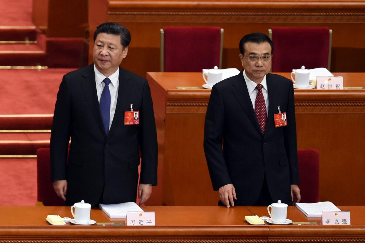 Chinese leader Xi Jinping (L) and Premier Li Keqiang arrive for the opening ceremony of the rubber-stamp legislature’s congress in Beijing, China, on March 5, 2016. (Wang Zhao/AFP via Getty Images)