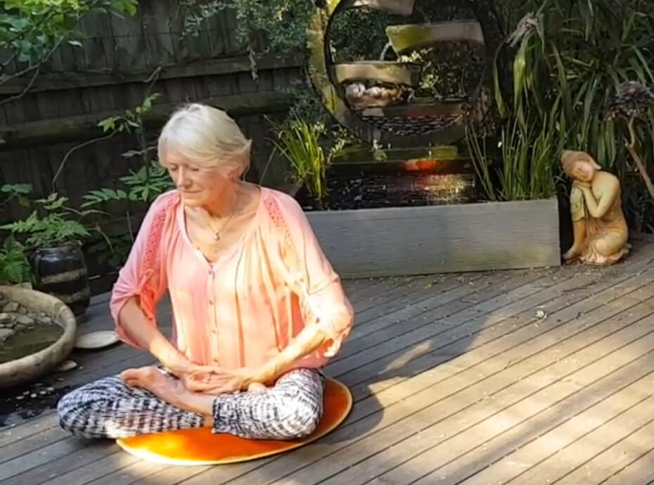 Jan Becker at 75 years old doing the sitting meditation, the fifth exercise of Falun Gong. (Courtesy of <a href="https://www.insightsmedia.com.au/films/protest-at-heavens-gate">Insights Media</a>)