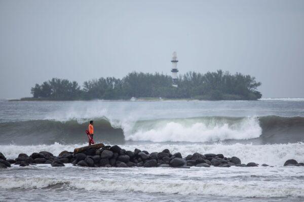 A lifeguard watches the surf in Boca del Rio, in the Veracruz state of Mexico, on Aug. 20, 2021. (Felix Marquez/AP Photo)