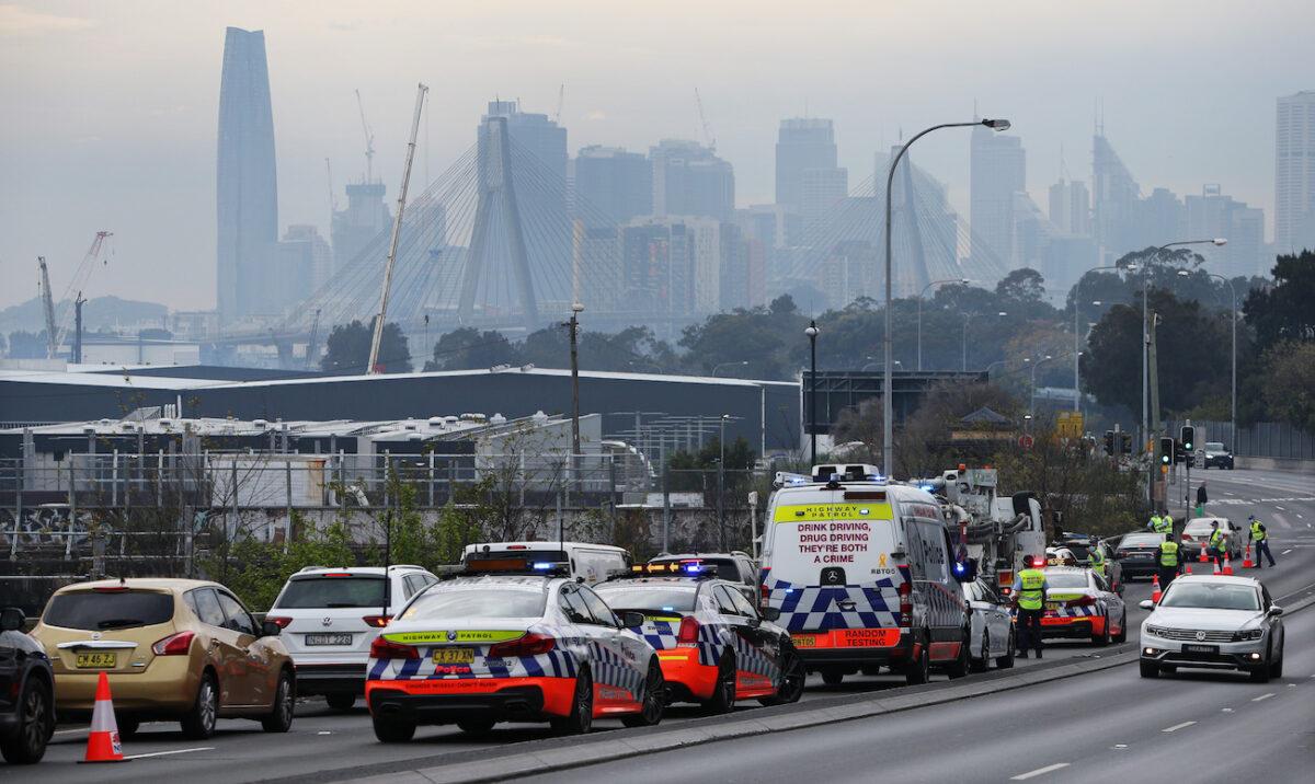 NSW police perform roadside checks along the City West Link at Lilyfield in Sydney, Australia, on Aug. 21, 2021. (Lisa Maree Williams/Getty Images)
