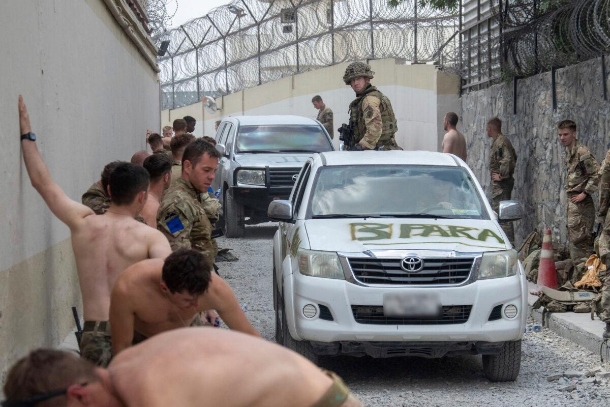 Members of the UK Armed Forces taking part in the evacuation of entitled personnel from Kabul airport in Afghanistan, on Aug. 20, 2021. (LPhot Ben Shread/Ministry of Defence via AP)