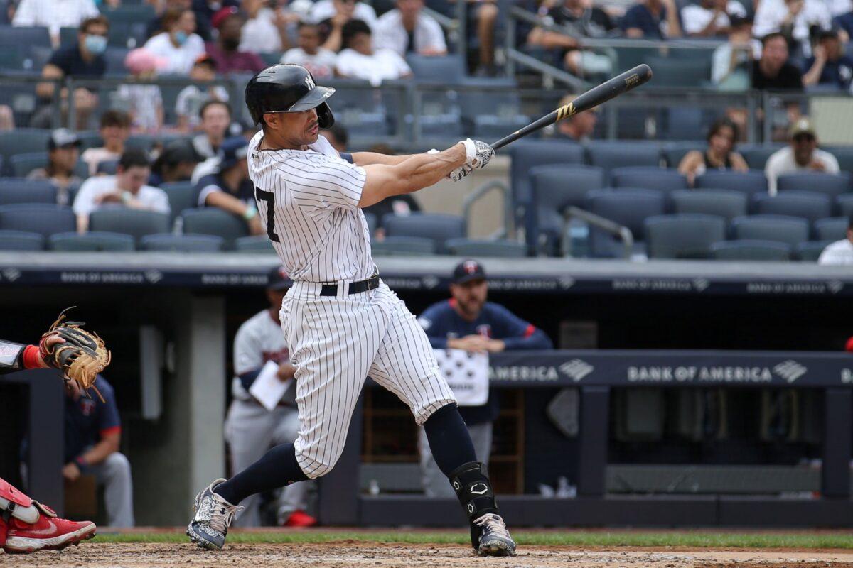 New York Yankees right fielder Giancarlo Stanton (27) follows through on a two run double against the Minnesota Twins during the fifth inning at Yankee Stadium, Bronx, N.Y., on Aug 21, 2021. (Brad Penner/USA TODAY Sports)