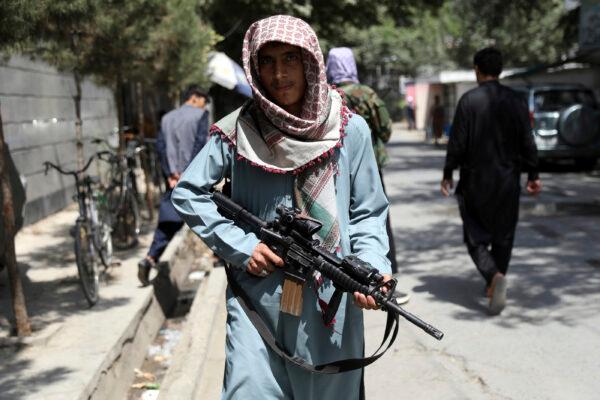 Taliban terrorists stand guard at a checkpoint in the Wazir Akbar Khan neighborhood in the city of Kabul, Afghanistan, on Aug. 22, 2021. (Rahmat Gul/AP Photo)