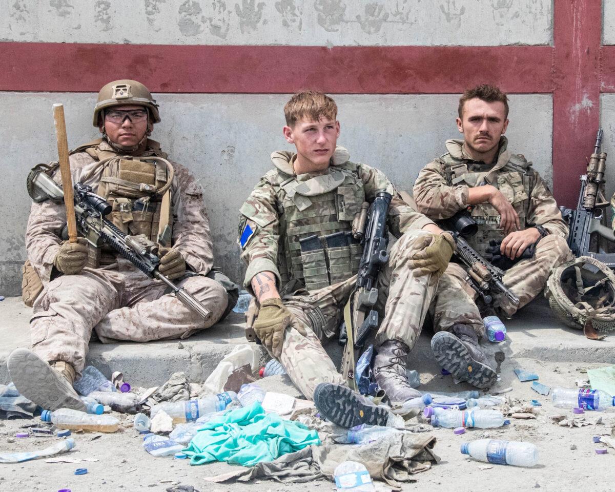 Members of the British and U.S. (left) military engaged in the evacuation of people out of Kabul, Afghanistan, on Aug. 20, 2021. (MoD/PA)