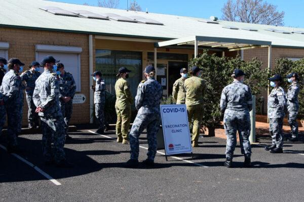 Australian Defence Force personnel are seen outside a COVID-19 vaccination clinic in Dubbo, Australia, on Aug. 20, 2021. (Belinda Soole/Getty Images)