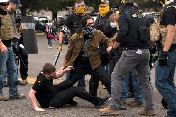 People clash during rival rallies in Portland, Ore., on Aug. 22, 2021. (David Ryder/Reuters)