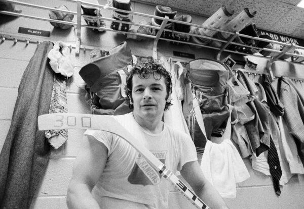 New York Rangers right wing Rod Gilbert displays a hockey stick marked with a "300," the total number of goals he has scored in his career, in the Rangers' locker room in New York, on March 25, 1974. (John Lent/File/AP Photo)