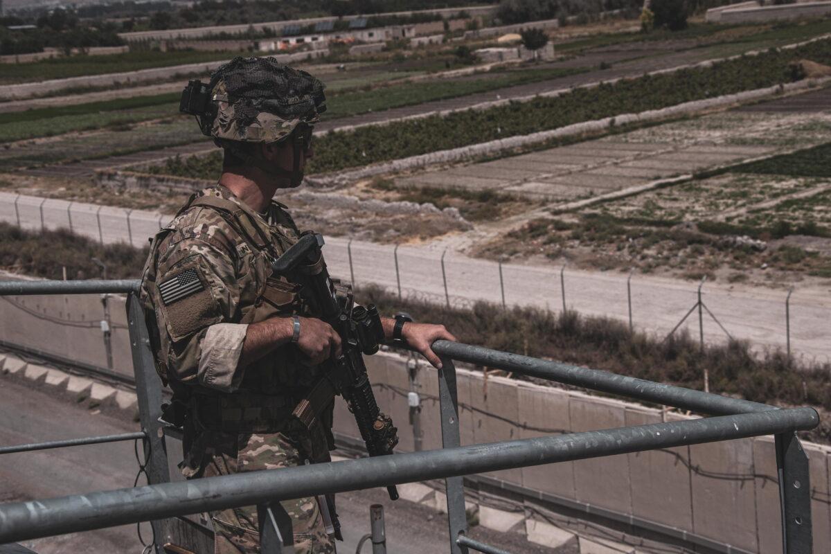 A soldier assigned to the 82nd Airborne Division provides security at Hamid Karzai International Airport, Afghanistan, on Aug. 21, 2021. (U.S. Marine Corps/Cpl. Davis Harris)