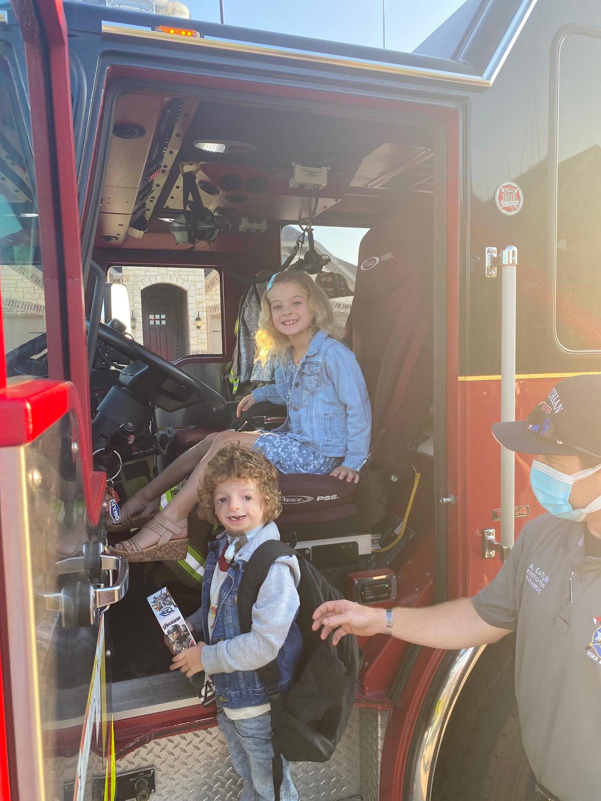 Michael and his sister in the fire truck on the first day of kindergarten. (Courtesy of <a href="https://www.facebook.com/brittanydenisonrealtor">Brittany Denison</a>)