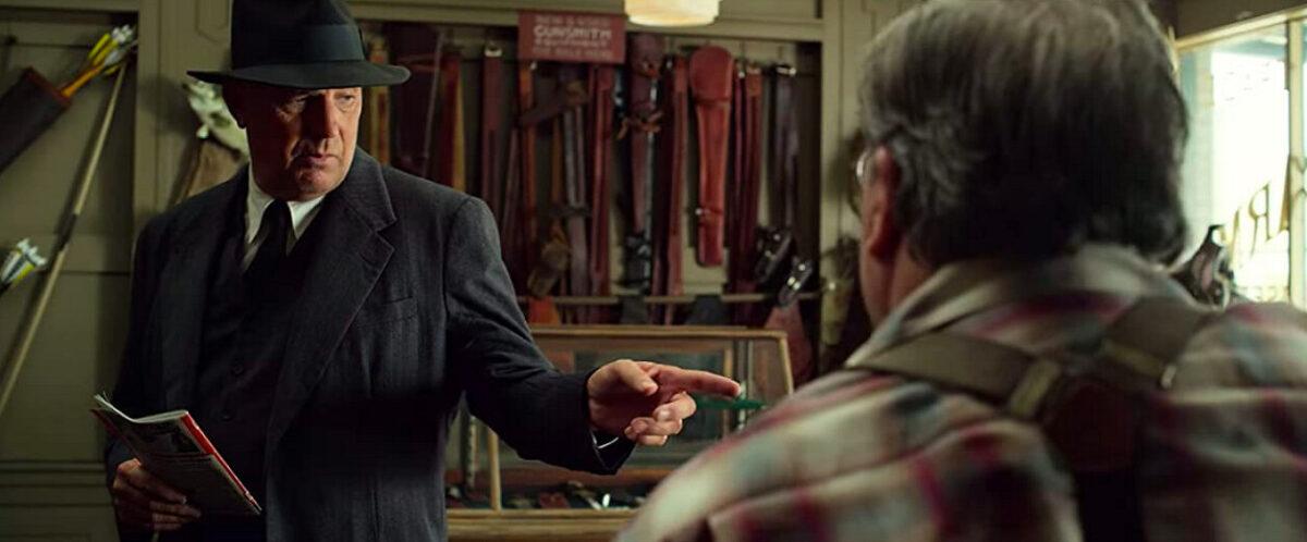 Frank Hamer (Kevin Costner), in a gun shop, buys a considerable load of lethal gear and ammo in "The Highwaymen." (Netflix)