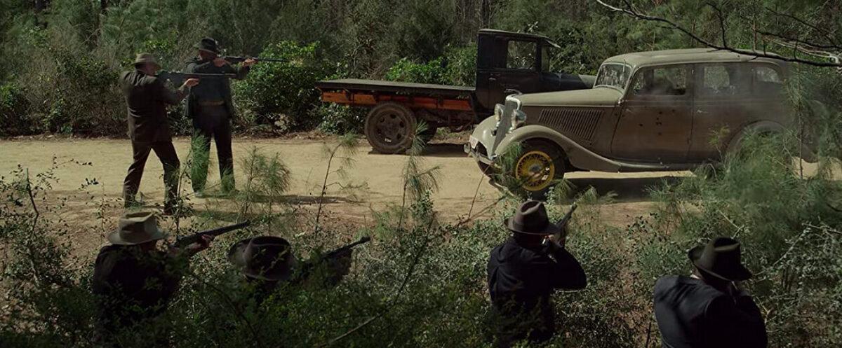 Gault, Hamer, and a posse of lawmen ambush Bonnie and Clyde in "The Highwaymen." (Netflix)